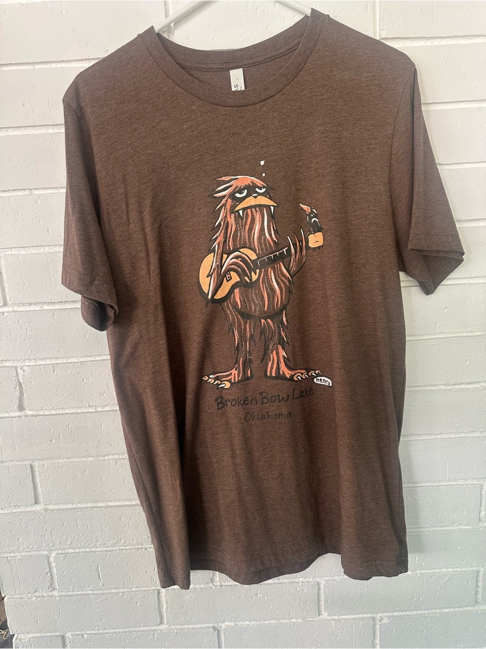 Brown Graphic Tee with Guitar Monster Illustration